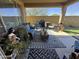 Covered patio featuring comfortable seating, a patterned rug, and outdoor decor at 6516 W Madre Del Oro Dr, Phoenix, AZ 85083