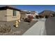 Street view of a row of single-story homes featuring desert landscaping in front and mountains in the background at 6516 W Madre Del Oro Dr, Phoenix, AZ 85083