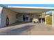 Covered carport with golf cart and storage at 8500 E Southern Ave # 537, Mesa, AZ 85209