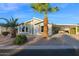 Tan single-story home with palm trees and carport at 8500 E Southern Ave # 537, Mesa, AZ 85209