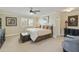 Inviting bedroom with neutral décor, large window, and comfortable furnishings at 8631 E Vista Dr, Scottsdale, AZ 85250