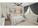 Bright bedroom features neutral tones, ceiling fan, and comfortable furnishings at 8631 E Vista Dr, Scottsdale, AZ 85250