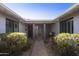 Inviting entryway with a brick pathway and lush greenery at 8631 E Vista Dr, Scottsdale, AZ 85250