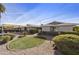 Attractive mid-century modern home with well-manicured landscaping and a spacious front yard at 8631 E Vista Dr, Scottsdale, AZ 85250