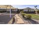 Landscaped front yard with a stone walkway leading to the entrance of the home at 8631 E Vista Dr, Scottsdale, AZ 85250