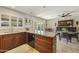 Eat-in kitchen with granite island and dark wood cabinetry at 8631 E Vista Dr, Scottsdale, AZ 85250