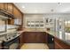 Updated kitchen with granite countertops and a breakfast bar at 8631 E Vista Dr, Scottsdale, AZ 85250
