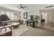 Inviting living room with neutral tones, a ceiling fan, and access to the rest of the house at 8631 E Vista Dr, Scottsdale, AZ 85250