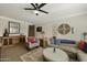 Cozy living room with a sectional sofa, arm chair and decorative wall art at 8631 E Vista Dr, Scottsdale, AZ 85250