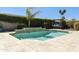Private pool area with travertine tile, mature hedges, and a sunning area at 8631 E Vista Dr, Scottsdale, AZ 85250