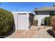 Backyard shed with neutral paint and stone walkway at 8631 E Vista Dr, Scottsdale, AZ 85250