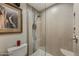 Large shower with glass enclosure and modern tile at 8631 E Vista Dr, Scottsdale, AZ 85250