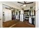 Spacious walk-in closet with custom shelving, ample storage, and a mirrored wall at 8631 E Vista Dr, Scottsdale, AZ 85250
