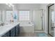 Bathroom boasts double sinks, soaking tub, and shower at 9628 E Olla Ave, Mesa, AZ 85212