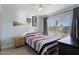 Bedroom with a double bed, nightstand, and window coverings at 9628 E Olla Ave, Mesa, AZ 85212