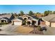 Single-story house with a two-car garage and landscaped front yard at 9628 E Olla Ave, Mesa, AZ 85212
