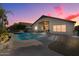 Inviting backyard oasis featuring a sparkling pool and patio area at 9628 E Olla Ave, Mesa, AZ 85212