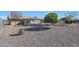 Large backyard with gravel and desert landscaping at 9821 W Cedar Dr, Sun City, AZ 85351