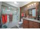 Clean bathroom with granite vanity, shower/tub combo, and mirror at 9821 W Cedar Dr, Sun City, AZ 85351