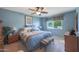 King-size bed, light and bright, with ensuite bath at 9821 W Cedar Dr, Sun City, AZ 85351