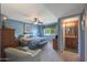 Spacious bedroom with king-size bed and ensuite bathroom at 9821 W Cedar Dr, Sun City, AZ 85351