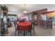 Kitchen and dining area with red table and chairs at 9821 W Cedar Dr, Sun City, AZ 85351