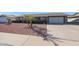 House exterior with drought-tolerant landscaping at 9821 W Cedar Dr, Sun City, AZ 85351