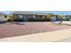 Ranch style home with palm trees and gravel yard at 9821 W Cedar Dr, Sun City, AZ 85351