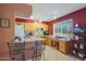 Well-equipped kitchen with wood cabinets, granite counters, and a breakfast bar at 9821 W Cedar Dr, Sun City, AZ 85351