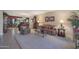 Spacious living room with plush seating and large windows at 9821 W Cedar Dr, Sun City, AZ 85351