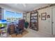 Home office with comfortable seating, desk, and lots of storage at 9821 W Cedar Dr, Sun City, AZ 85351