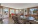 Bright sunroom with ample seating and large windows, providing access to the backyard at 9821 W Cedar Dr, Sun City, AZ 85351