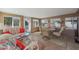 Cozy sunroom with comfortable seating and large windows, offering plenty of natural light at 9821 W Cedar Dr, Sun City, AZ 85351