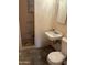 Simple bathroom includes a toilet, sink, and shower stall at 10025 N 13Th Pl, Phoenix, AZ 85020