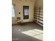 Bright entryway with built-in shelving and exterior door at 10025 N 13Th Pl, Phoenix, AZ 85020