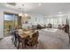 Open concept dining area with a view of the living room at 10260 E White Feather Ln # 2003, Scottsdale, AZ 85262