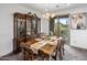 Elegant dining room with large china cabinet and access to balcony at 10260 E White Feather Ln # 2003, Scottsdale, AZ 85262