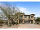 Two-story home with attached garages and desert landscaping at 10260 E White Feather Ln # 2003, Scottsdale, AZ 85262