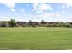 Green golf course with residential buildings in background at 10260 E White Feather Ln # 2003, Scottsdale, AZ 85262