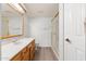 Bathroom with shower, tub and wood vanity at 10330 W Thunderbird Blvd # C119, Sun City, AZ 85351