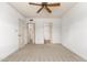 Bedroom with mirrored closet doors and access to bathroom at 10330 W Thunderbird Blvd # C119, Sun City, AZ 85351