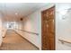 Residential hallway with wood doors and carpeting at 10330 W Thunderbird Blvd # C119, Sun City, AZ 85351