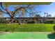 View of grassy backyard with covered parking at 10330 W Thunderbird Blvd # C119, Sun City, AZ 85351