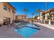 Community pool and spa with surrounding lounge chairs at 10330 W Thunderbird Blvd # C119, Sun City, AZ 85351