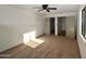 Well-lit bedroom featuring neutral carpeting and built-in closet at 10331 W Willie Low Cir, Sun City, AZ 85351