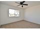 Bright bedroom with carpet flooring and ceiling fan at 10331 W Willie Low Cir, Sun City, AZ 85351