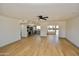 Spacious living room featuring hardwood floors and a ceiling fan at 10331 W Willie Low Cir, Sun City, AZ 85351