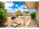 Backyard with gravel, covered patio, and storage shed at 10461 W Devonshire Ave, Phoenix, AZ 85037