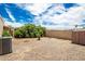 Backyard with gravel, bushes, and storage shed at 10461 W Devonshire Ave, Phoenix, AZ 85037