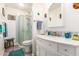 Clean bathroom with a walk-in shower and updated vanity at 10461 W Devonshire Ave, Phoenix, AZ 85037